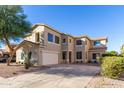 Spacious two-story home with a wide driveway and a charming desert-landscaped front yard at 1430 E Douglas St, Casa Grande, AZ 85122