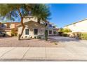 Beautiful two-story home with desert landscaping, stucco siding, and a welcoming front yard at 1430 E Douglas St, Casa Grande, AZ 85122