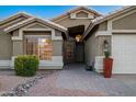 Charming home with desert landscaping, paved walkway, and well-maintained exterior at 15149 W Vale Dr, Goodyear, AZ 85395