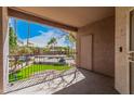 Private balcony with iron railing, offering outdoor views of the landscaped community at 17017 N 12Th St # 2012, Phoenix, AZ 85022