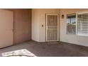 Private entryway with security screen door, showing a glimpse of the unit's entrance at 17017 N 12Th St # 2012, Phoenix, AZ 85022