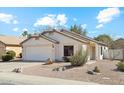 Well-maintained single-story home with a two-car garage and desert landscaping at 2123 E Catclaw St, Gilbert, AZ 85296