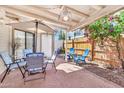 A cozy patio with a table and chairs, great for outdoor dining and relaxation at 2455 E Broadway Rd # 13, Mesa, AZ 85204