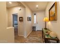 Bright foyer with neutral walls, tile flooring, and decorative furnishings creating a welcoming entrance at 27654 N 125Th Dr, Peoria, AZ 85383
