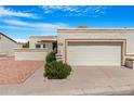Charming home featuring low-maintenance landscaping and a two-car garage on a sunny day, creating a welcoming curb appeal at 2844 W Christy Dr, Phoenix, AZ 85029