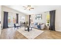 Bright living room with wood floors, vaulted ceiling, and neutral colors at 2916 E Amber Ridge Way, Phoenix, AZ 85048