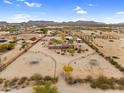 Expansive aerial view showcasing the desert property, horse facilities and surrounding landscape under a blue sky at 29204 N Bryce Trl, Queen Creek, AZ 85144