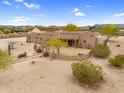 Southwestern home featuring desert landscaping, mature trees, and a stucco exterior at 29204 N Bryce Trl, Queen Creek, AZ 85144