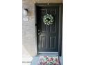 Charming front door with a decorative wreath and welcome mat, creating an inviting entryway to the home at 2929 W Yorkshire Dr # 2118, Phoenix, AZ 85027