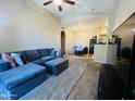 Inviting living room features vaulted ceilings, plush seating, and open layout seamlessly connecting to the dining area at 2929 W Yorkshire Dr # 2118, Phoenix, AZ 85027