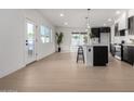 Spacious open-concept living area featuring new flooring, modern lighting, and a bright, airy atmosphere at 4147 W Cheery Lynn Rd, Phoenix, AZ 85019