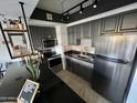 Well-lit kitchen features stainless steel appliances, modern fixtures, and ample counter space at 4750 N Central Ave # 1N, Phoenix, AZ 85012