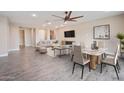 Spacious living room featuring a sleek TV, dining area, and comfortable seating for relaxation at 5100 E Rancho Paloma E Dr # 1046, Cave Creek, AZ 85331
