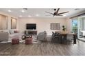 Open-concept living area with comfortable seating, a television, and access to an outdoor patio at 5100 E Rancho Paloma E Dr # 1046, Cave Creek, AZ 85331