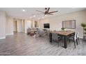 Open-concept living and dining area with modern furnishings, stylish decor, and tile flooring at 5100 E Rancho Paloma E Dr # 1046, Cave Creek, AZ 85331