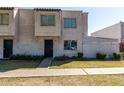 Inviting two-story home with textured walls and neutral color palette, and xeriscaped yard at 5254 N 42Nd Pkwy, Phoenix, AZ 85019