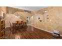 Dining area showcasing hardwood floors and access to the staircase and other rooms at 5749 S 249Th Dr, Buckeye, AZ 85326