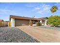 Spacious two-car garage with a wide driveway, offering convenience and ample parking at 6134 E Hannibal St, Mesa, AZ 85205