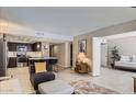 Open concept living area with a seamless transition to the modern kitchen, perfect for entertaining at 7960 E Camelback Rd # 209, Scottsdale, AZ 85251