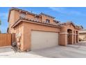 View of the side of the home featuring a spacious driveway and a neutral-colored exterior at 1343 E Walnut Rd, Gilbert, AZ 85298