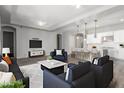 Bright open floor plan seamlessly blends living and kitchen, perfect for modern living and entertaining guests at 2626 S Olympic Dr, Gilbert, AZ 85295