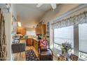 Bright kitchen featuring wood cabinets, granite countertops and an eat-in breakfast bar at 3104 E Broadway Rd # 212, Mesa, AZ 85204