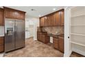 Well-appointed kitchen showcasing stainless steel appliances, plenty of counter space, and wooden cabinets at 3747 E Harmony Ave, Mesa, AZ 85206