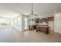 Spacious kitchen and dining area with a central island, stainless steel appliances, and recessed lighting at 3933 W Sandra Ter, Phoenix, AZ 85053