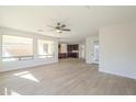 Open floor plan featuring wood-look floors and a kitchen view perfect for entertaining at 3933 W Sandra Ter, Phoenix, AZ 85053