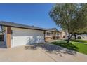 Well-maintained home with a spacious driveway and attached garage, set in a lovely neighborhood at 4646 E Contessa St, Mesa, AZ 85205