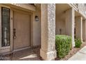 Close-up of the front door showing the property number and lush landscaping at 1001 N Pasadena -- # 5, Mesa, AZ 85201