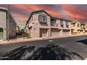 Beautiful townhome complex featuring private garages, a balcony, and well-maintained landscaping at 1250 S Rialto -- # 47, Mesa, AZ 85209