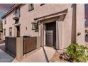 Inviting front entryway with a secure screen door, private fenced yard, and desert landscaping at 1250 S Rialto -- # 47, Mesa, AZ 85209