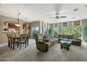 Inviting living room and dining area showcasing comfortable seating, a ceiling fan, and seamless flow at 16525 E Avenue Of The Fountains Ave # 201, Fountain Hills, AZ 85268