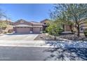 Charming single-Gathering home featuring a three-car garage, tile roof, and well-maintained landscaping at 2609 W Mcneil St, Phoenix, AZ 85041