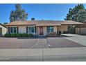 Charming single-story home with desert landscaping, brick walkway and covered parking at 3661 W Oakland St, Chandler, AZ 85226