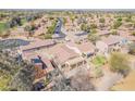 Comfortable home with well-kept lawn, patio, fire pit, and verdant landscaping at 7227 S Golfside Ln, Phoenix, AZ 85042