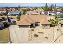 Aerial view of a single-Gathering home with a well-maintained yard in a residential neighborhood at 7542 W Dahlia Dr, Peoria, AZ 85381