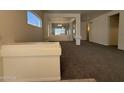 Spacious living room featuring neutral paint, carpet, and great natural light at 18563 N 116Th Dr, Surprise, AZ 85378