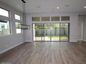 Light-filled living room with large sliding glass doors, offering seamless indoor-outdoor living at 1956 W Rowel Rd, Phoenix, AZ 85085