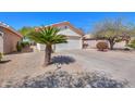 Well-maintained front yard showcasing desert landscaping and a charming home exterior at 2390 E Antigua Dr, Casa Grande, AZ 85194