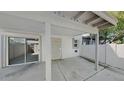 Covered back patio includes sliding glass door and security screen door access into the home at 4776 W Eva St, Glendale, AZ 85302