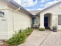 Inviting front entrance with neutral colors and desert landscaping at 10241 E La Palma Ave, Gold Canyon, AZ 85118