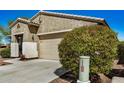 Attractive single-story home featuring a neutral-colored exterior and manicured landscaping at 10454 W Maya Way, Peoria, AZ 85383
