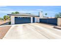 Spacious garage with a wide driveway and convenient side access at 1607 E Gable Ave, Mesa, AZ 85204