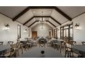 Versatile event space with high ceilings, wood beams, and ample seating, perfect for celebrations at 1948 W Rowel Rd, Phoenix, AZ 85085