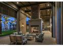 Inviting outdoor fireplace with comfortable seating, ideal for cozy evenings and social gatherings at 1948 W Rowel Rd, Phoenix, AZ 85085