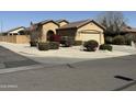 Inviting single-story home showcasing a manicured yard with lush landscaping, gravel, and healthy plants at 2132 W Gold Dust Ave, San Tan Valley, AZ 85144