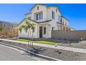 Beautifully designed two-story home featuring a manicured lawn, a welcoming entrance, and contemporary appeal at 2149 W Rowel Rd, Phoenix, AZ 85085