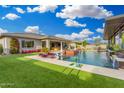 Backyard with pool, lush landscaping, and outdoor entertaining space at 22867 E Via Las Brisas --, Queen Creek, AZ 85142